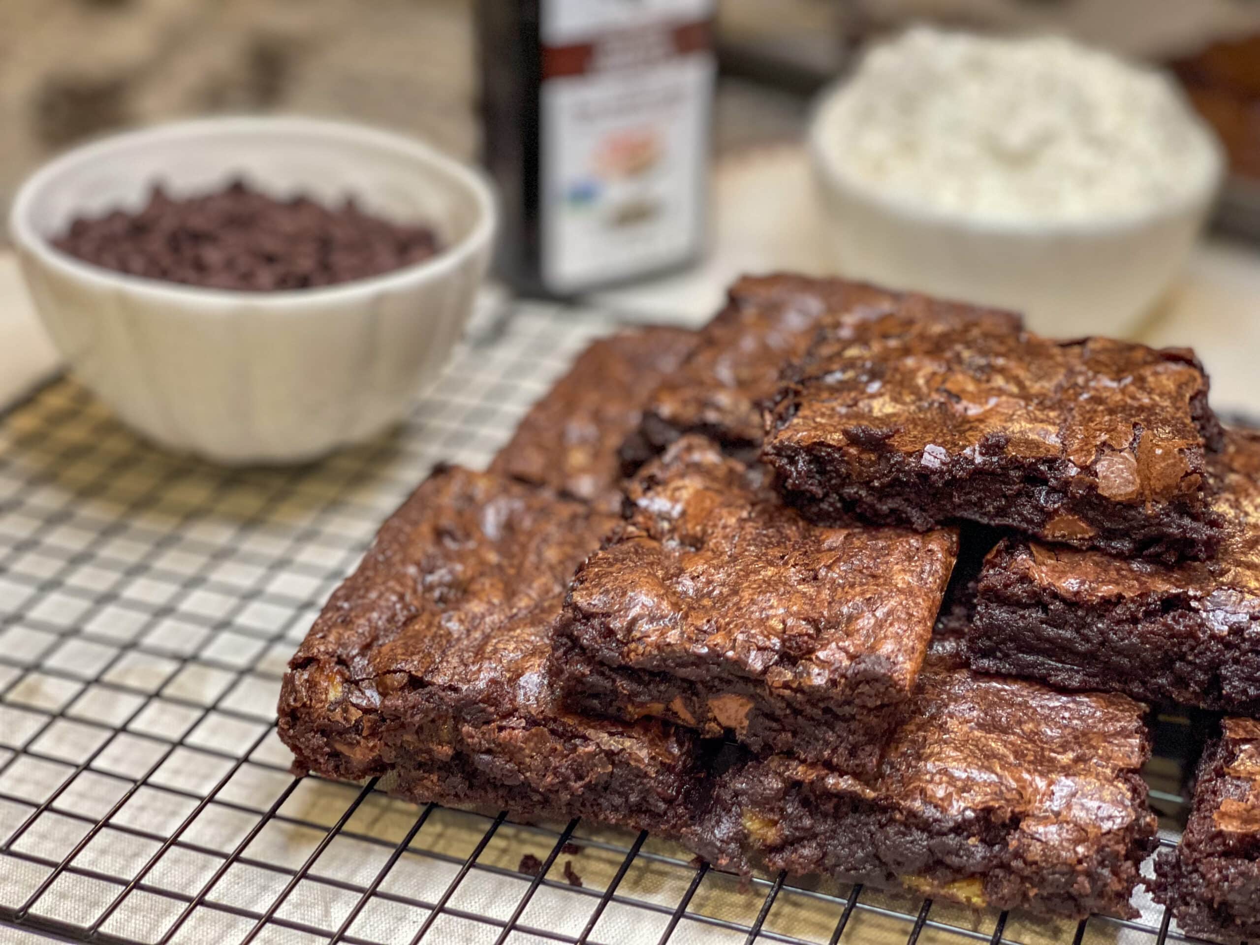 stack of brownies on a plate with chocolate chps in background