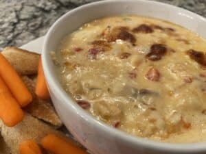 Baked Seafood Dip in White Bowl with Carrots