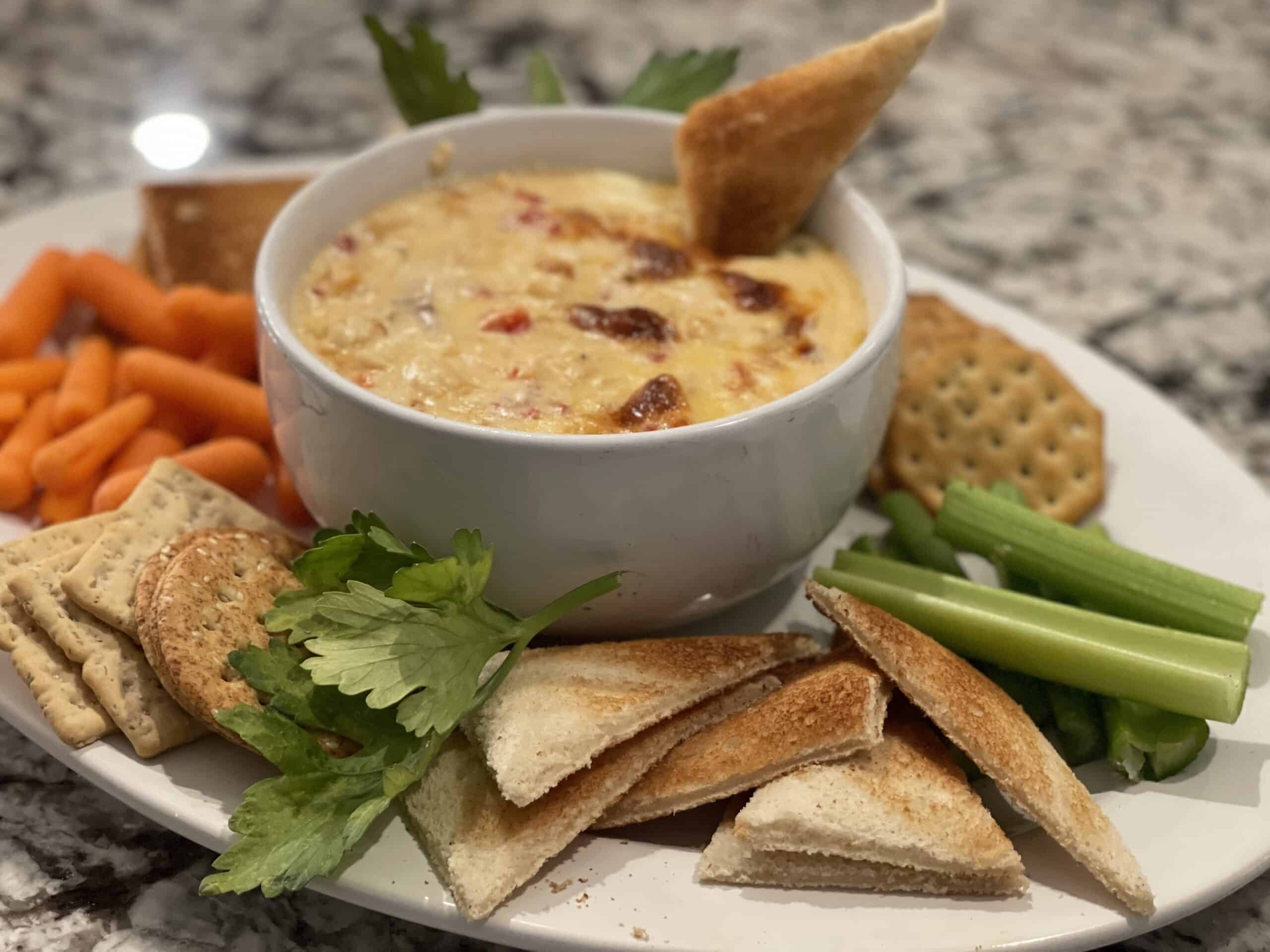 Baked Seafood dip, celery, toast points and carrots