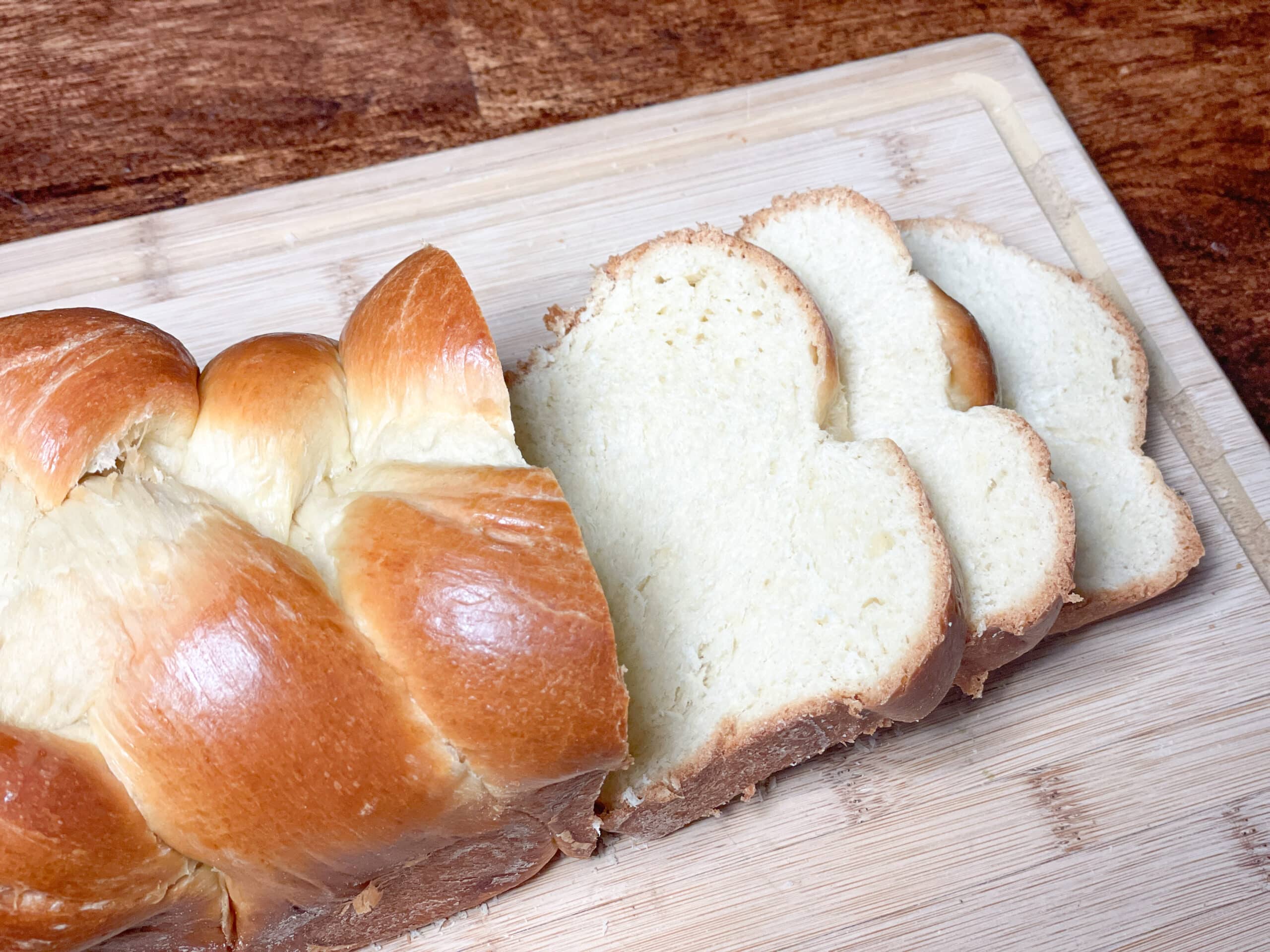 Sliced Homemade Brioche Bread Loaves on a cutting board