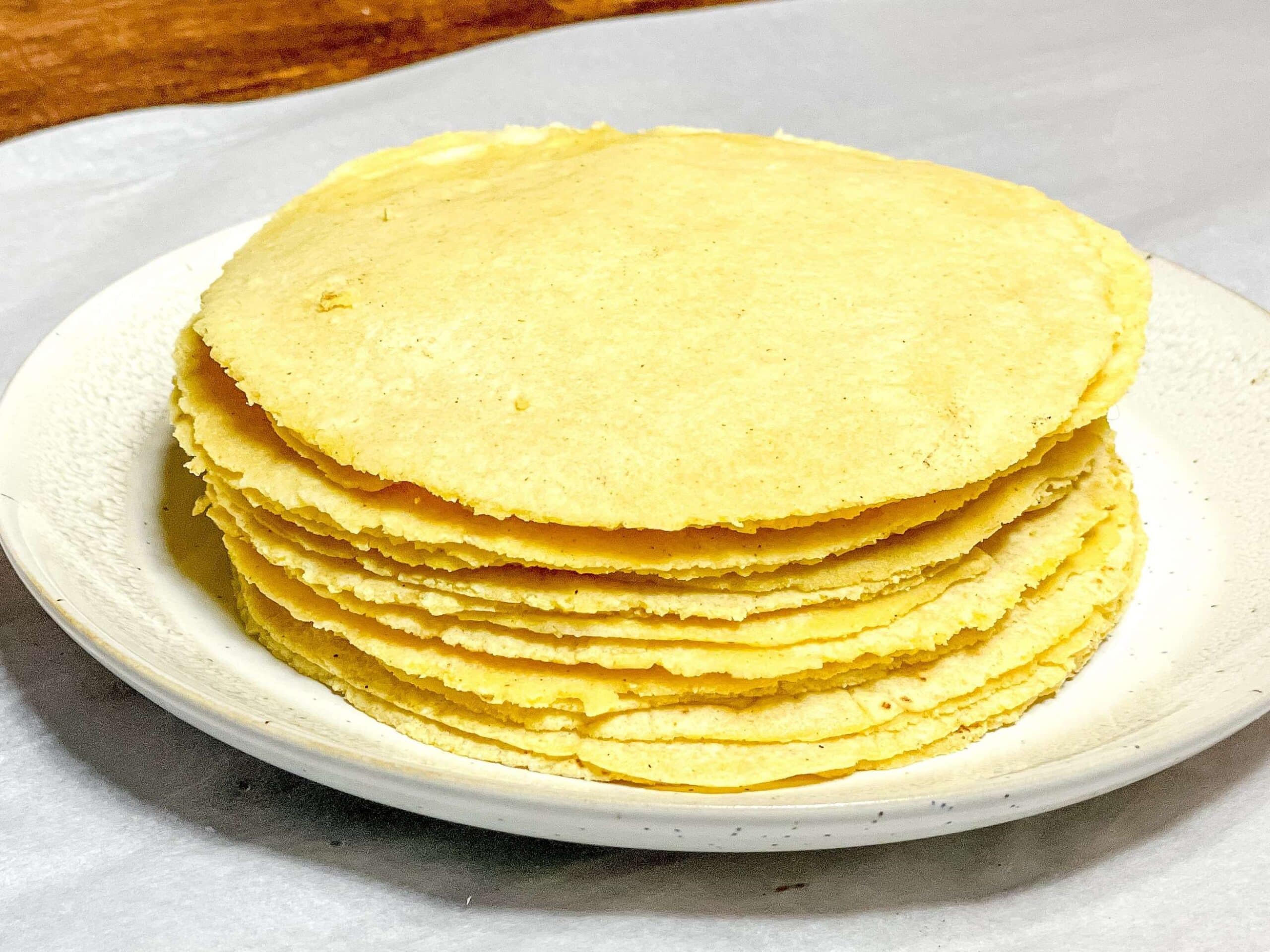 Stack of Corn Tortillas on a White Plate