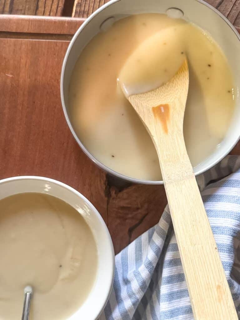 Cream of Chicken Soup in Bowl and Sauce Pan