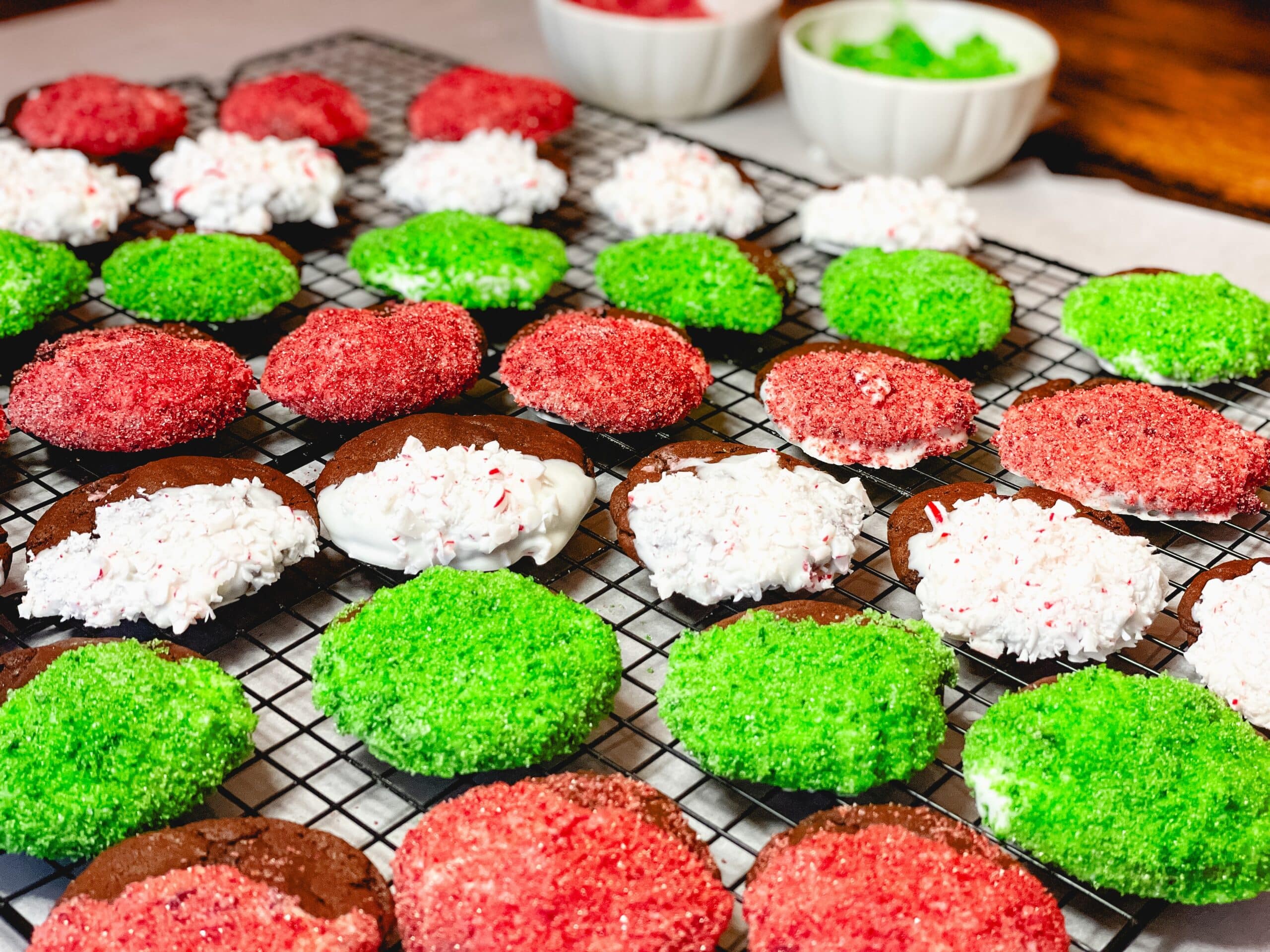 Peppermint Mocha Cookies with Sprinkles and candy canes on a cooling rack