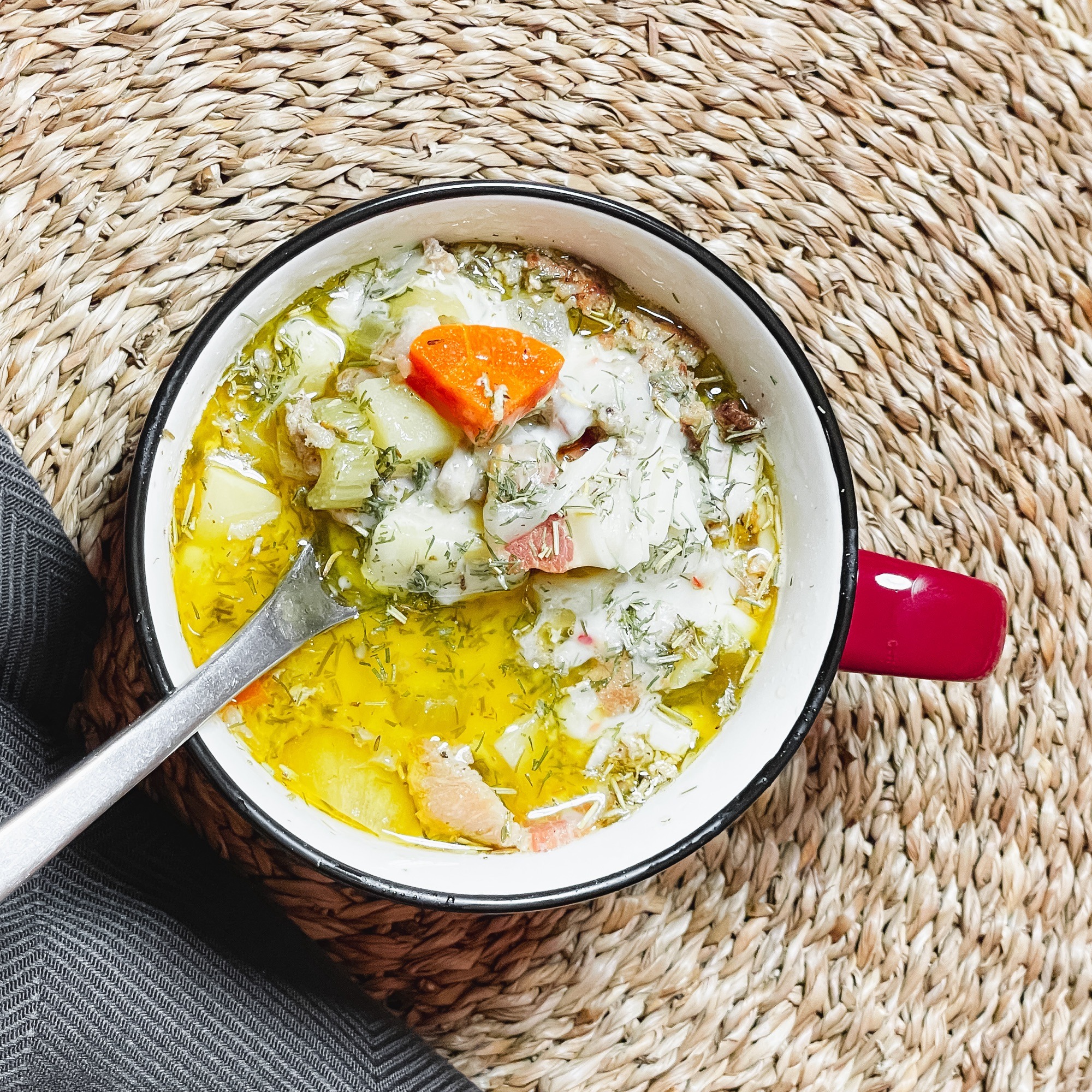 Loaded Potato soup served in a red crock