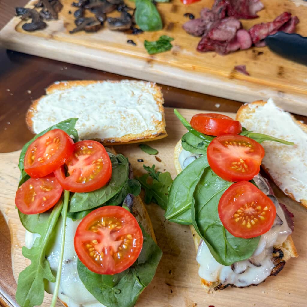 Steak Sandwich with Lettuce and Tomatoes on Top
