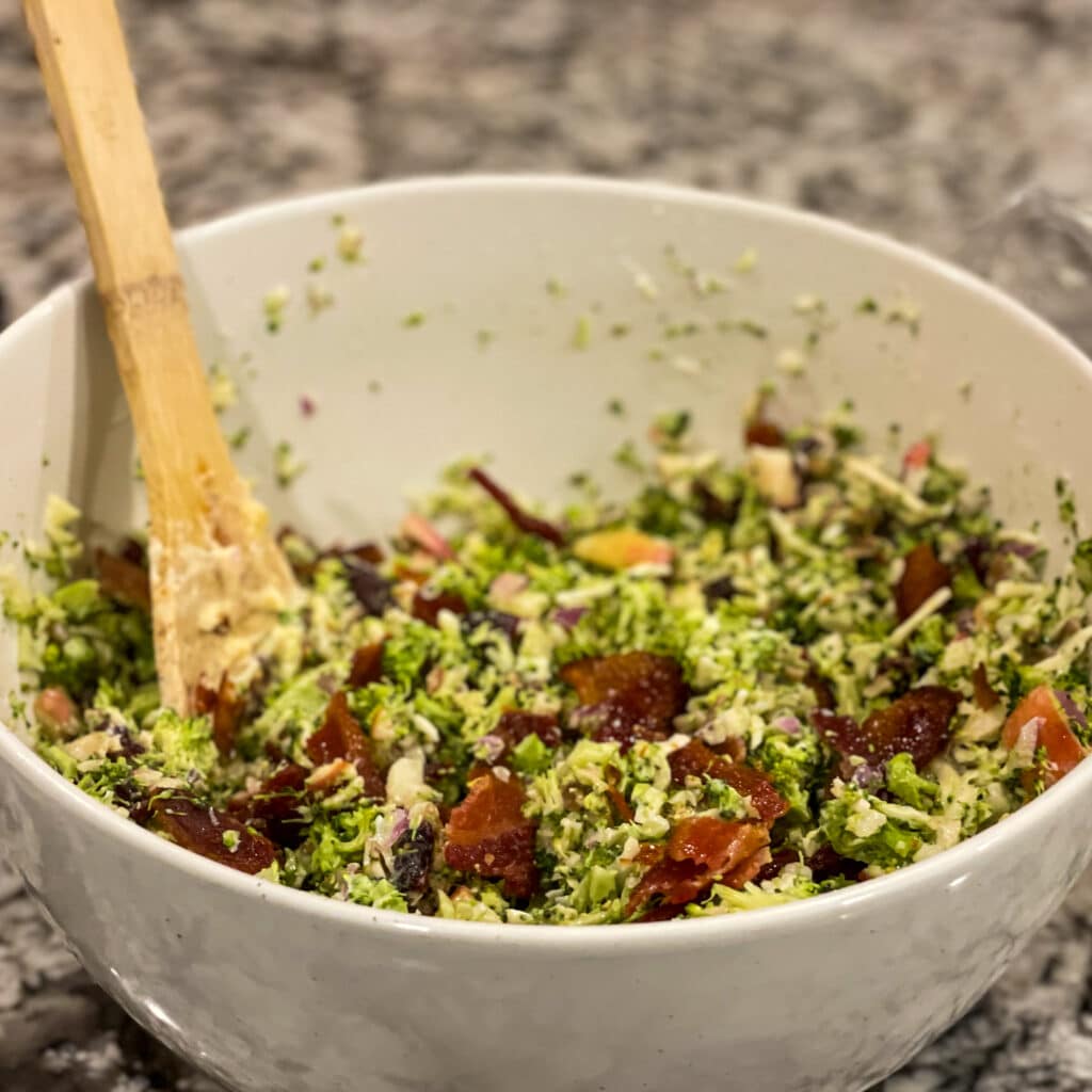 Different Angle of Loaded Broccoli Salad with a Wooden Spoon