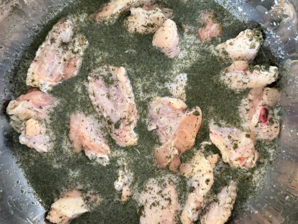 Chicken Wings Marinating in Buttermilk, Ranch and Dill