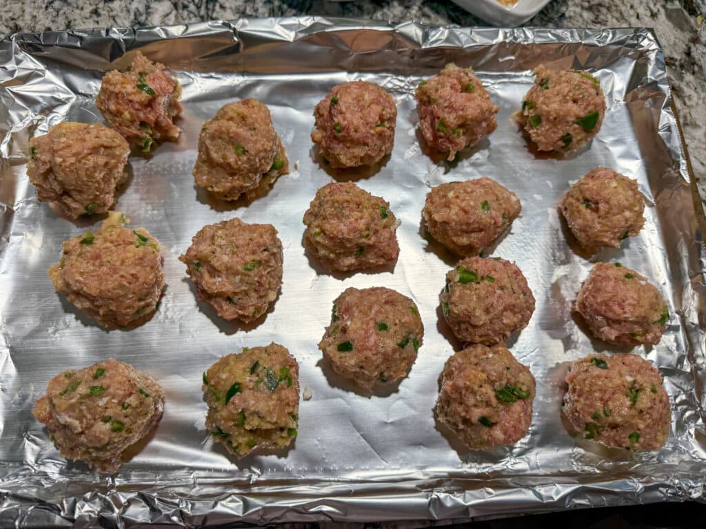 Cherry Jalapeno and Goat Cheese Meatballs Formed on Cookie Sheet