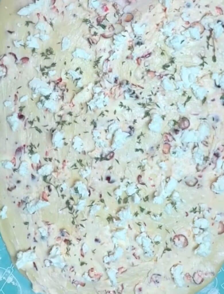 Cranberry Goat Cheese Dinner Roll Filling Spread on Dough