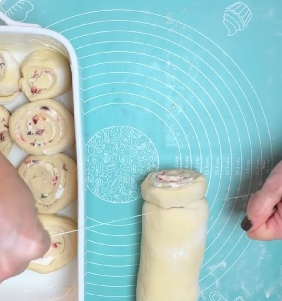 Slicing Cranberry Goat Cheese Dinner Rolls with Floss