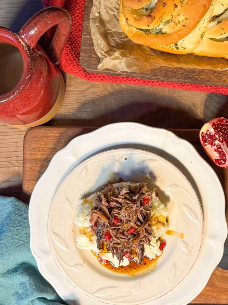Pomegranate Pot Roast on Mashed Potatoes