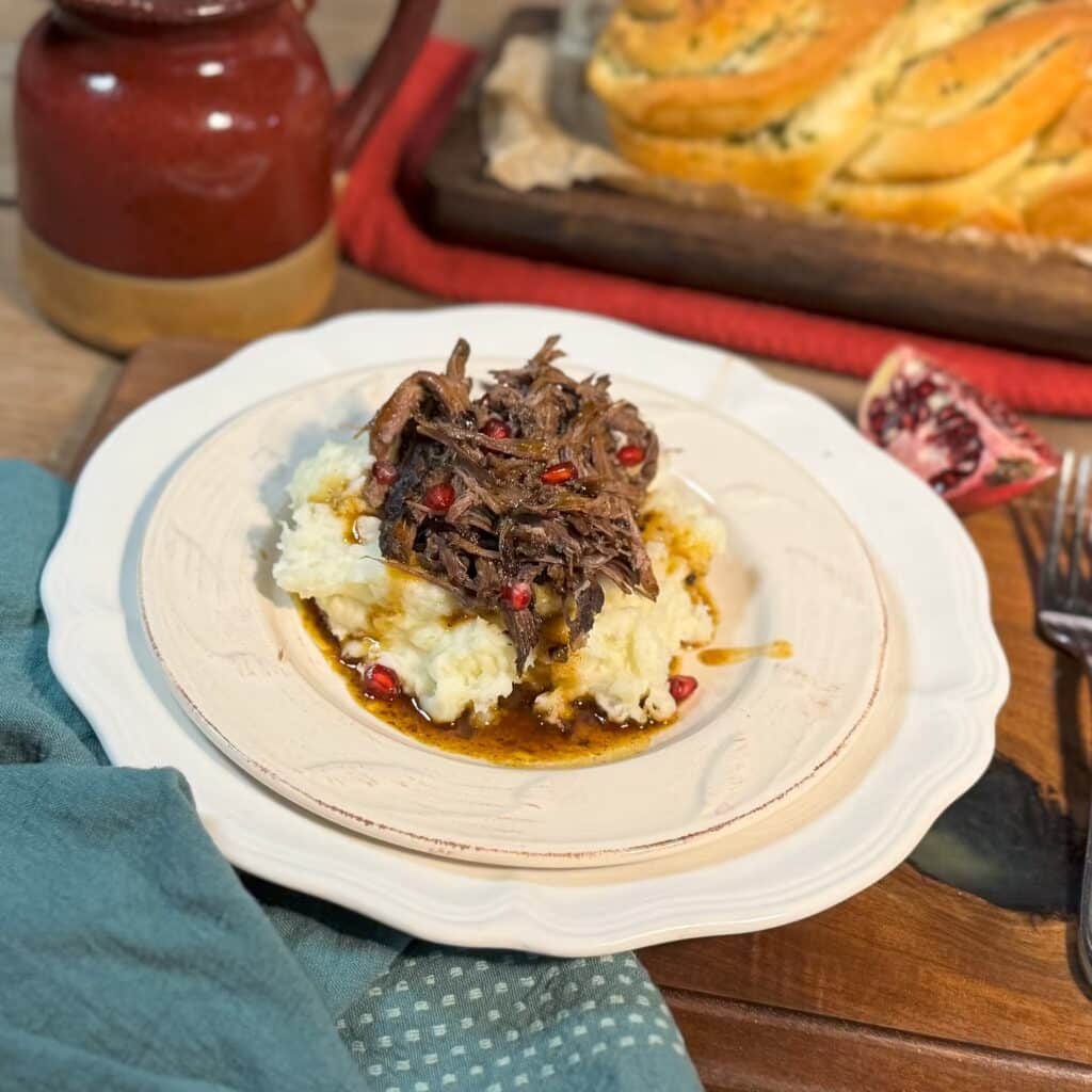 Pomegranate Pot Roast on Mashed Potatoes