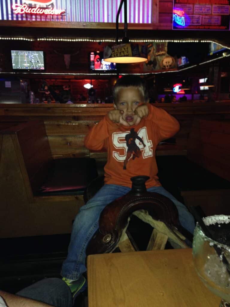 Boy on a Saddle at Texas Roadhouse