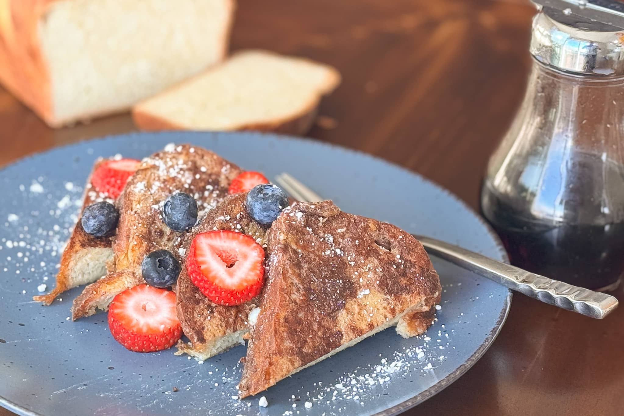 Slices of French Toast on a Blue Plate with Fruit