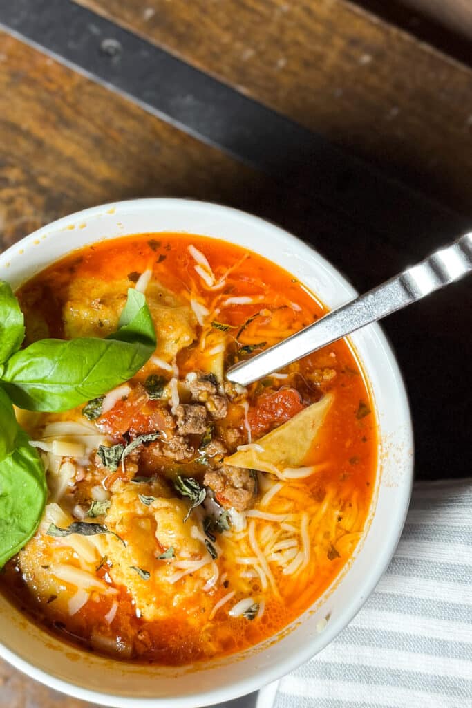 Lasagna Soup in a Bowl with Basil and a Spoon