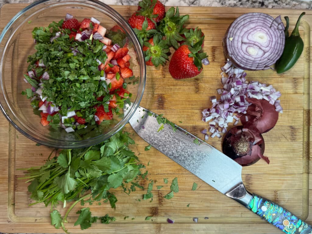 Cilantro in a Bowl with Scraps Around It Strawberry Pico De Gallo
