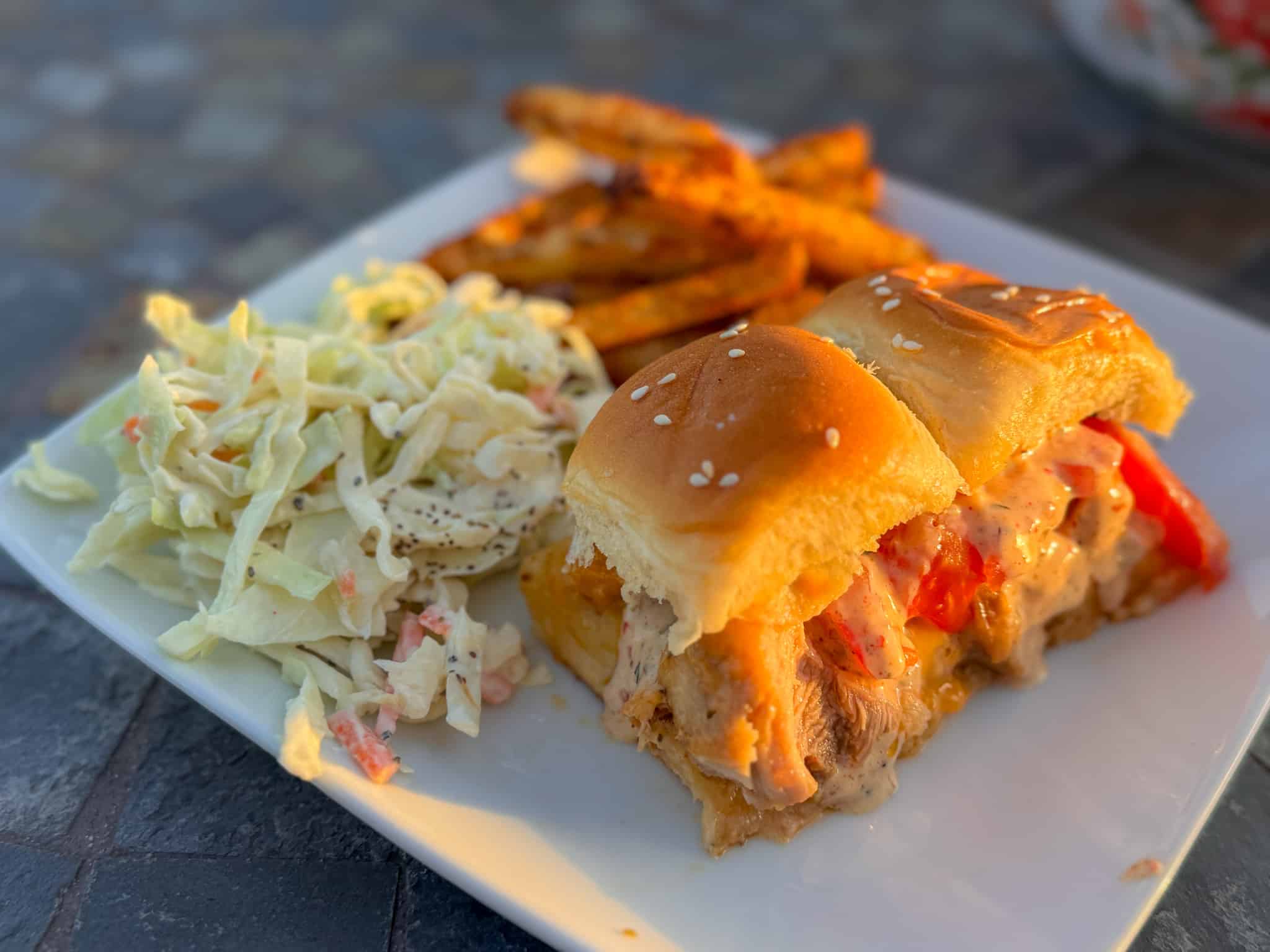 Cajun Chicken Sliders with a side of coleslaw and Cajun fries