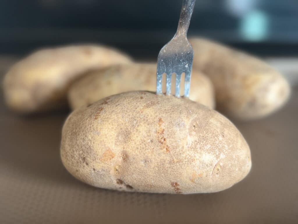 Potato with Fork in It