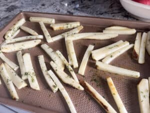 Layer Fries on Baking Sheet and Season Them