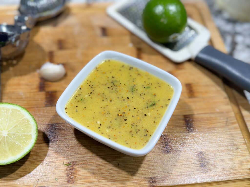 Zesty Lime Dressing for Corn Salad in a White Bowl