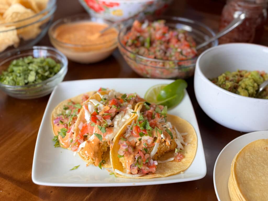 Baja Fish Tacos Surrounded by Toppings