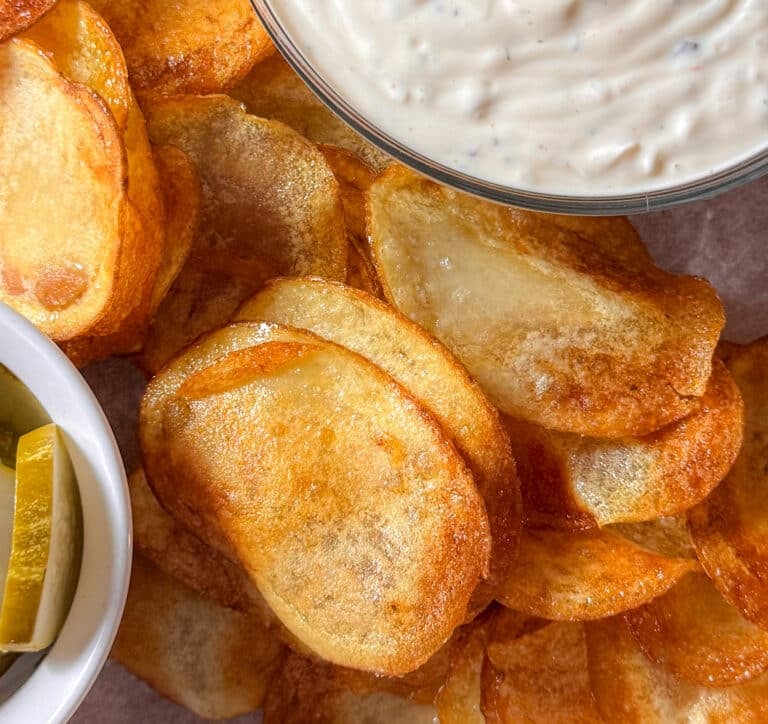 Homemade Potato Chips Next to Some Dip
