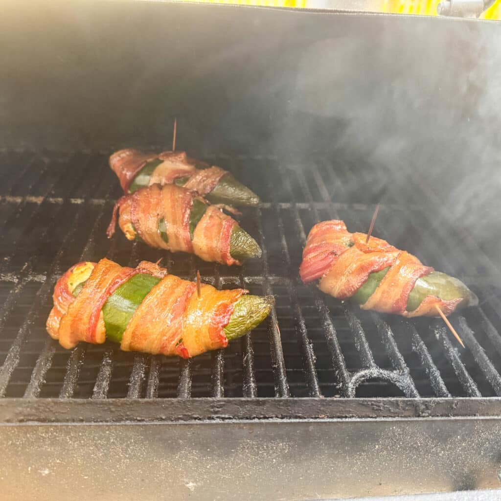Bacon Wrapped Stuffed Poblano Peppers on Smoker Almost Done