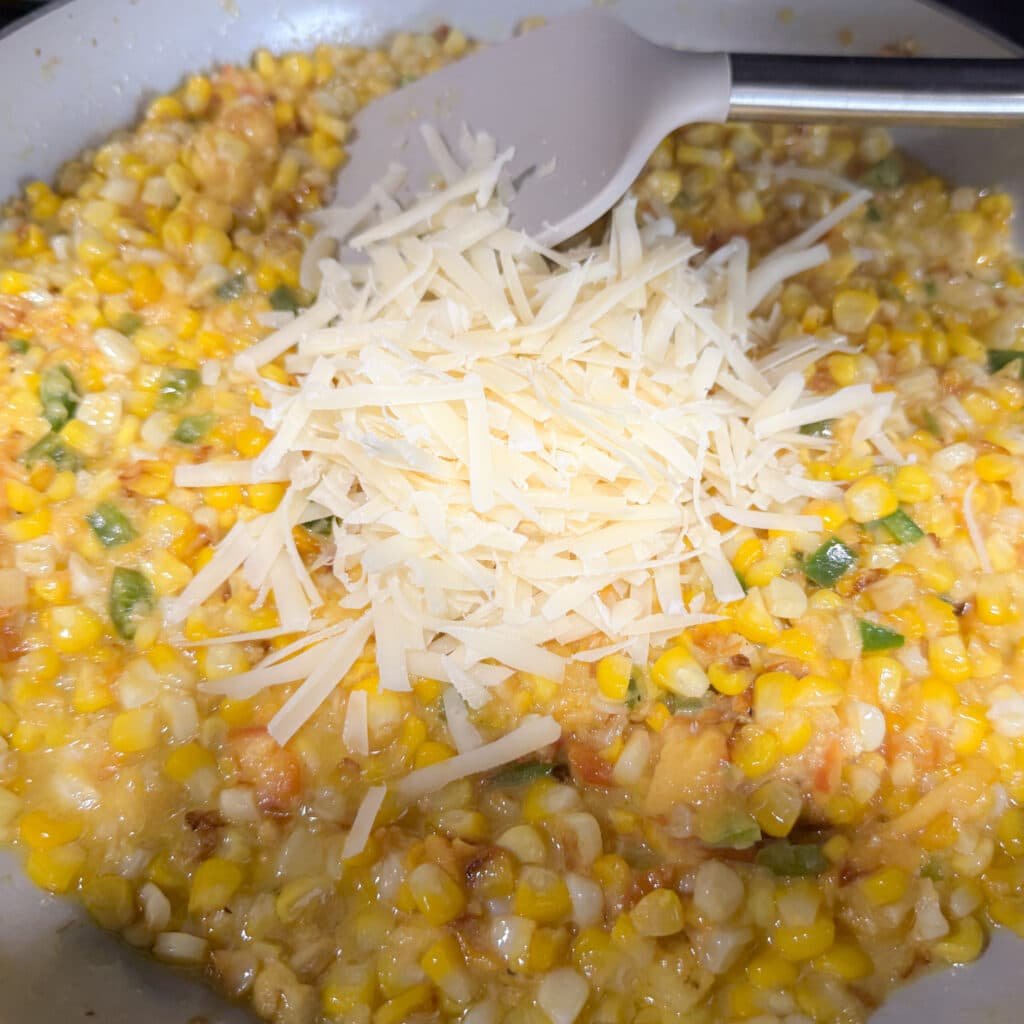 Shredded Parmesan on Top of Jalapeño Peach Creamed Corn
