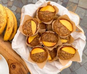 a Basket of Peach Banana Oat Muffins