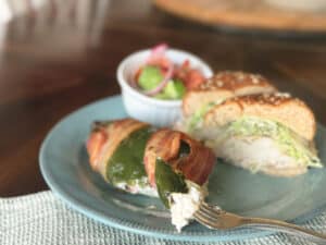 Stuffed Poblano Peppers on a Plate with a Chicken Sandwich