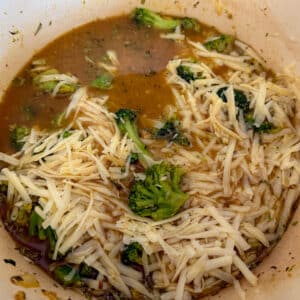 Cheesy Chicken Broccoli and Rice Adding Cheese and Broth