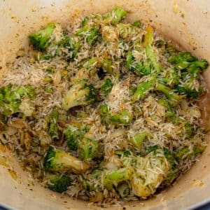 Adding Rice and Seasonings to Cheesy Chicken Broccoli and Rice