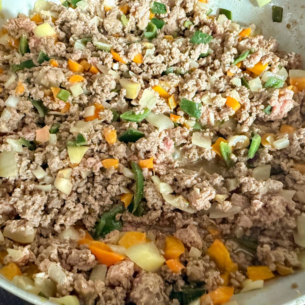 Browned Ground Beef, Peppers and Onions in Skillet