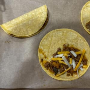Corn Tortillas Being Filled
