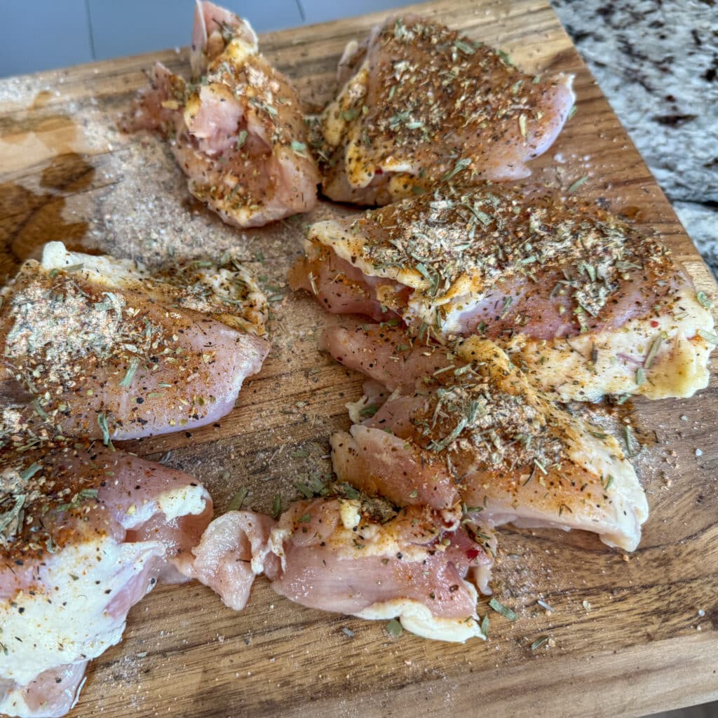 Season Chicken Thighs for Cheesy Chicken Broccoli and Rice