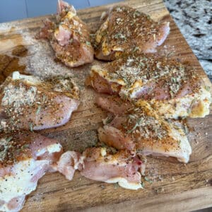Season Chicken Thighs for Cheesy Chicken Broccoli and Rice