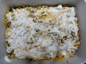 Sour Cream over Gouda and Macaroni in Casserole Dish