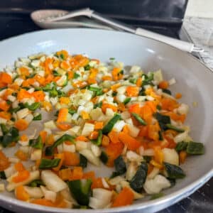 Peppers and Onions Cooking in a Skillet