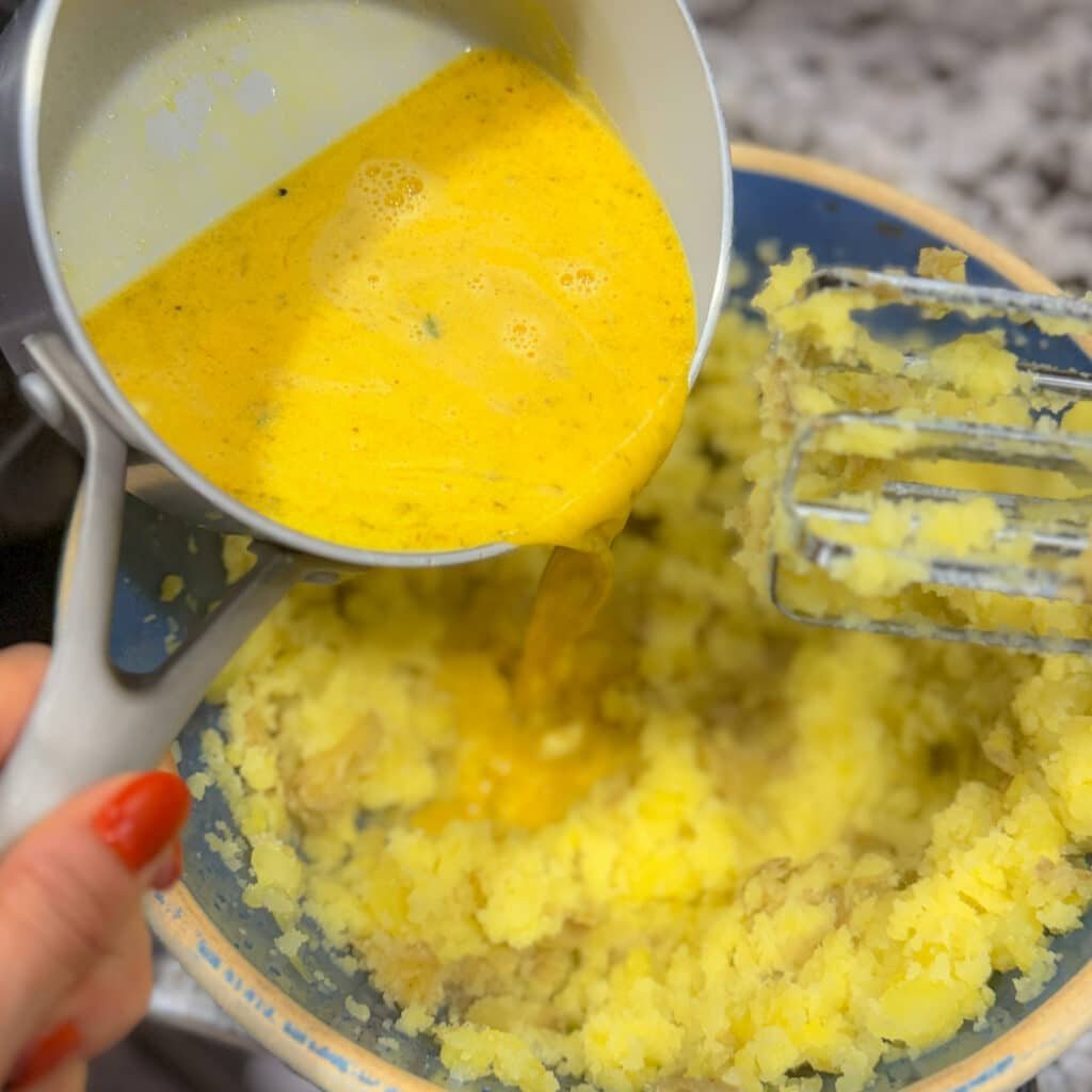 Adding the Aji Cream to Mashed Potatoes