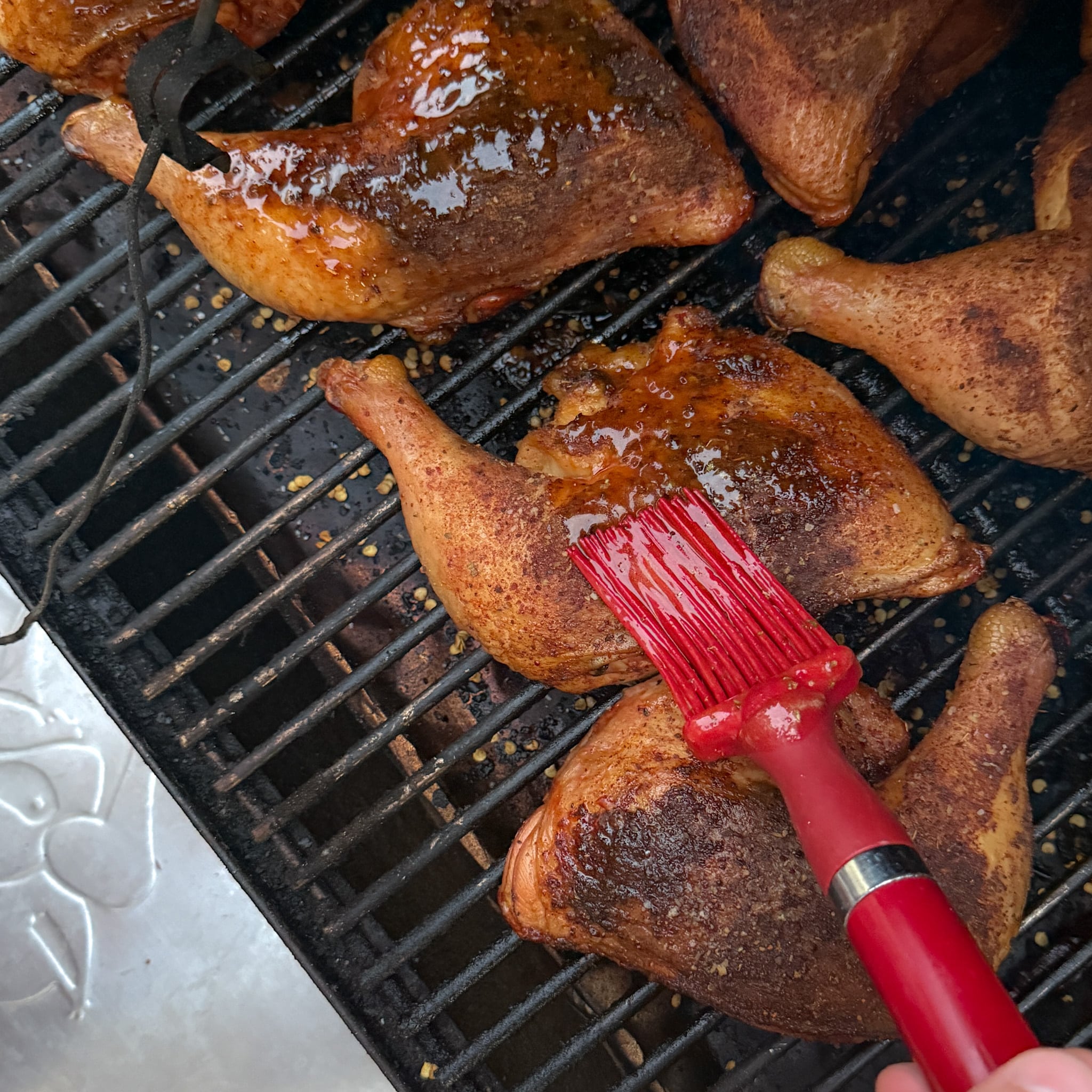Adding glaze to BBQ Chicken Quarters