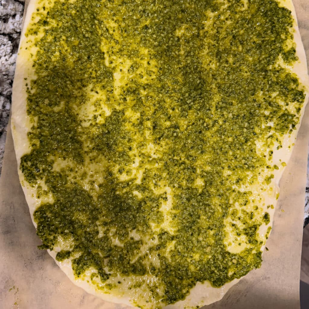 Pesto Sauce on Cheese on Mushrooms and Onions on Steak Topping for Steak and Gorgonzola Pizza