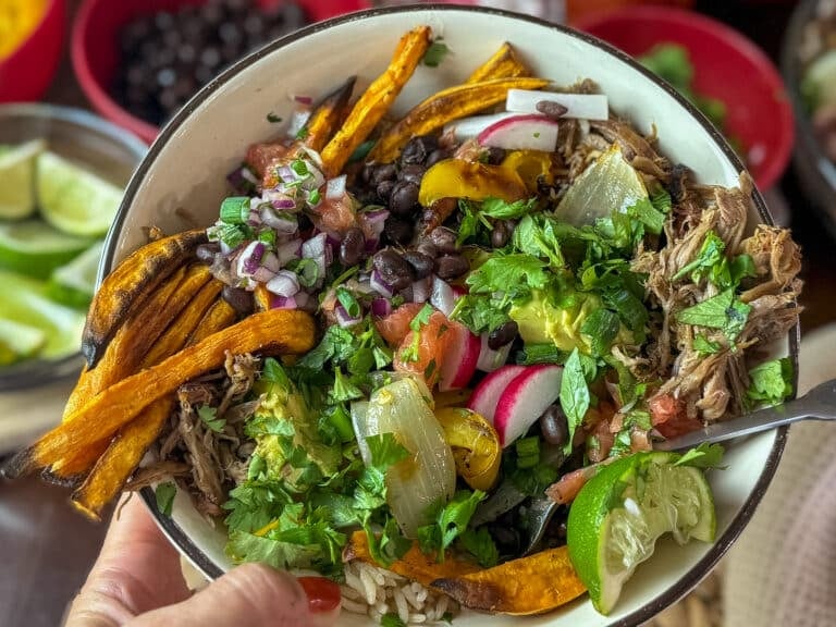 Hand Holding a Carnita Bowl
