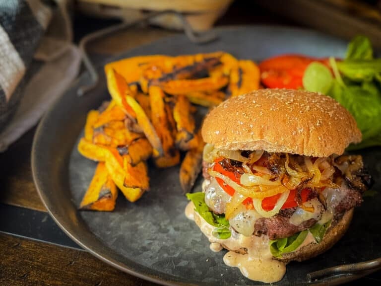 Juicy Smoky Ancho Cheeseburger with Melted White Cheddar, Spicy Adobo Mayo, and Caramelized Onion Mushroom Topping